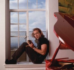 Nicolas Cage Holding His Cat --- Image by © Mark Hanauer/Corbis